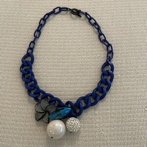 Statement necklace, great look on top of bright color sweater, dress